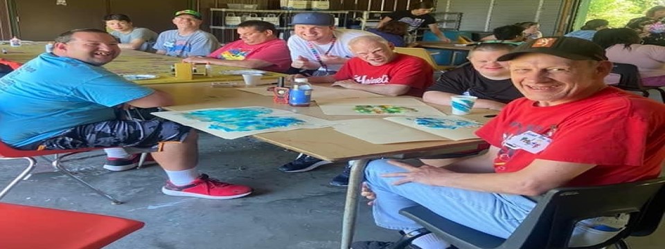 Campers enjoying art in art building